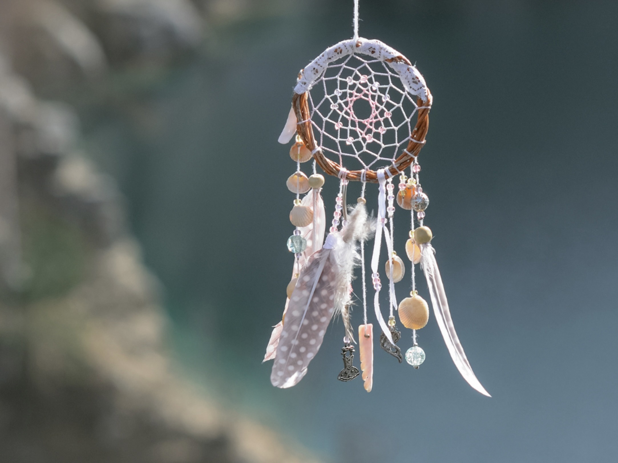 Dreamcatcher on blue background