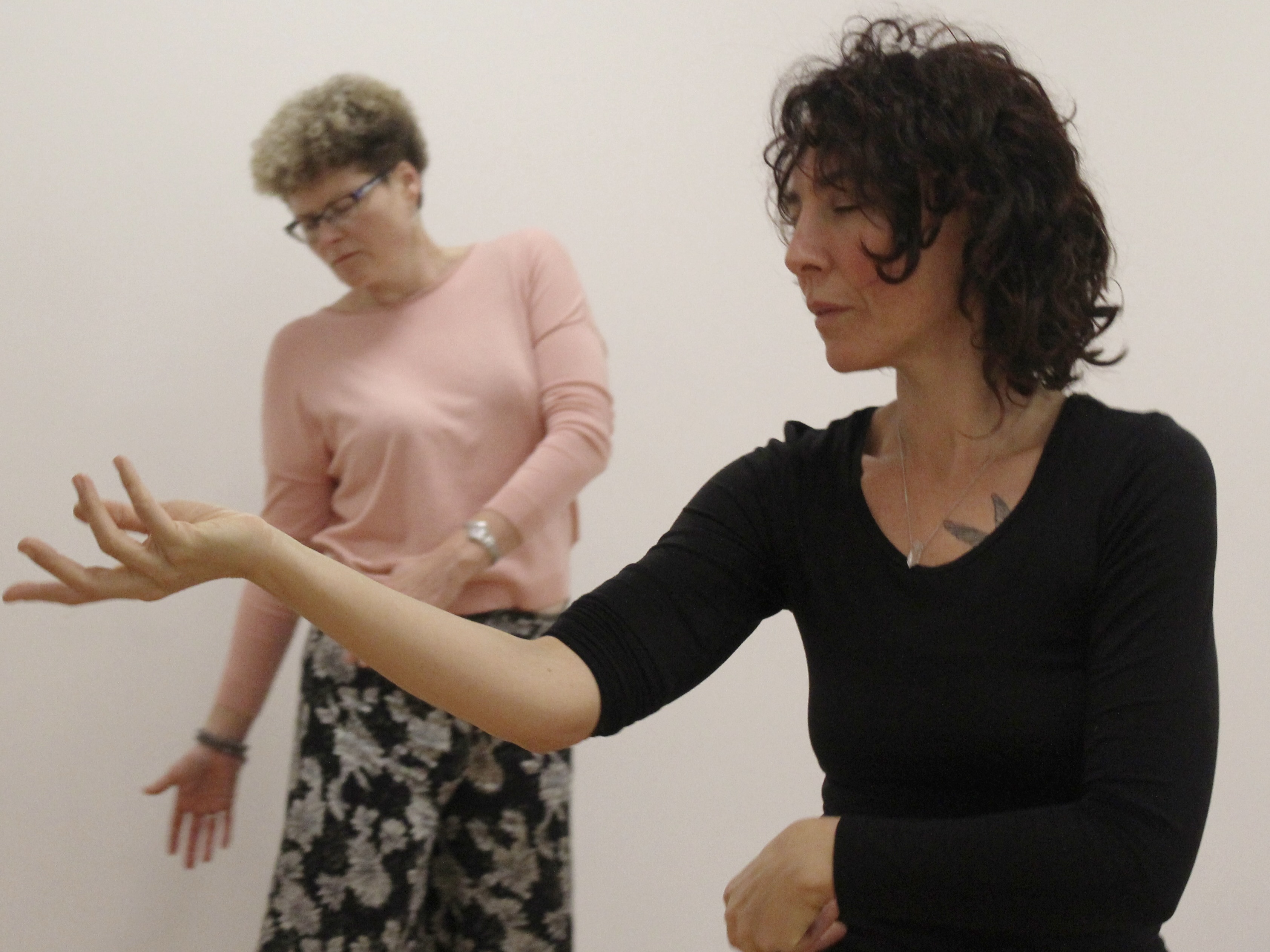 Women consciously listening in dance